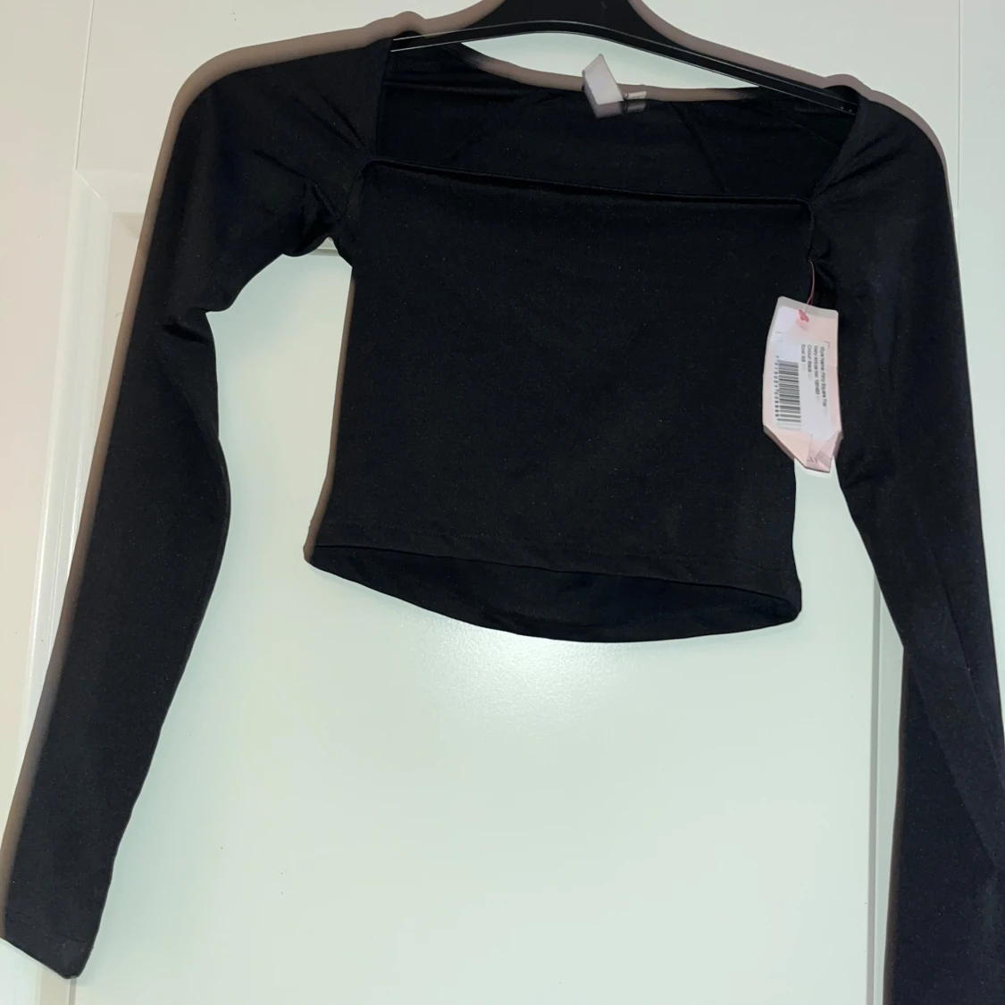 Svart långärmad topp från Nelly XS