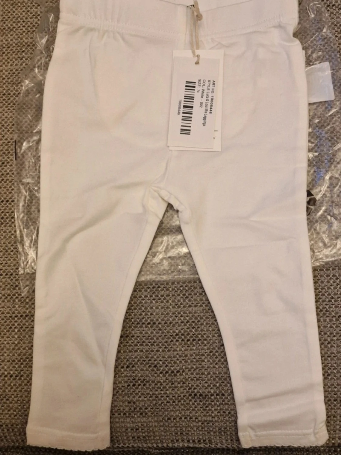 Vita leggings med volang bak