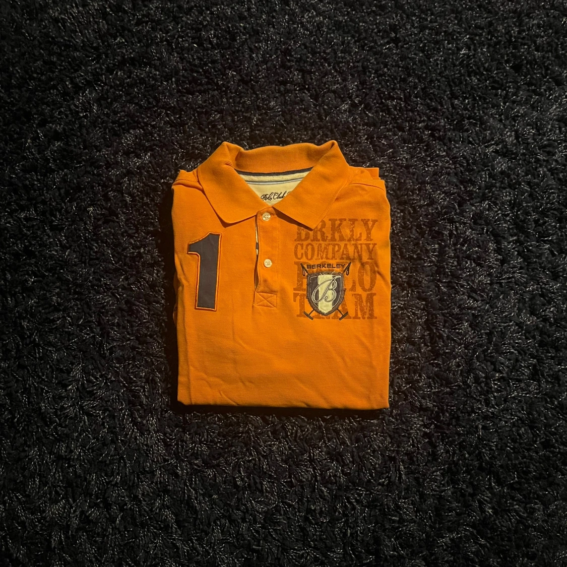 Orange pikétröja från Berkeley