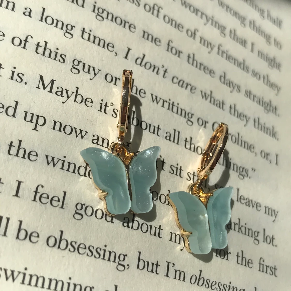 Ljusblåa fjärils örhängen - 90