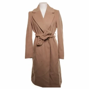 Kappa - Beige kappa från H&M. Jättemysig och varm, tjock tyg. 