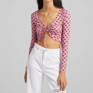 Rosa topp med snörning  - Endast provad