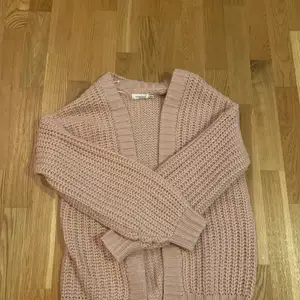 Pink cardigan. Very comfy and warm