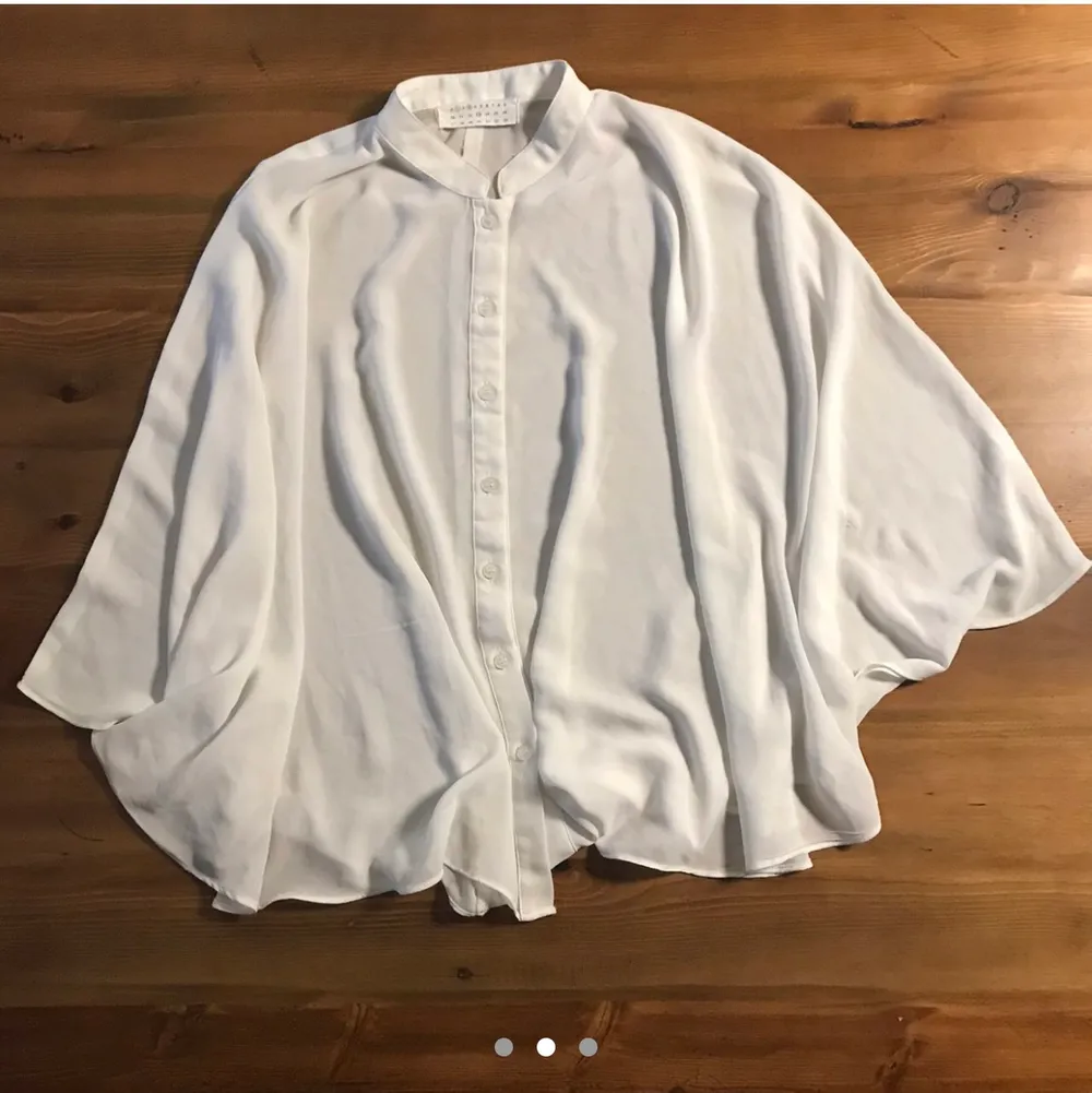 FREE TRACKED SHIPPING.   Nehru collar button down placket. Batwing cape sleeves. Tag size (Korean) XS but definitely fits S and some M. Bought from StyleNanda. One Size Fits Most. (I'm 5'4 and 98 lbs for reference!)  Worn twice then hand washed, NOT machine dried. Gently used excellent used condition. No holes, tears, rips, stains, snags. Smoke and pet free storage space. No other flaws to note.  Happy to bundle. Will gladly take more pics.  Disclaimer: Please expect some general wear in all secondhand pre-owned items as they have lived a previous life, so do not expect a mint item. . Toppar.