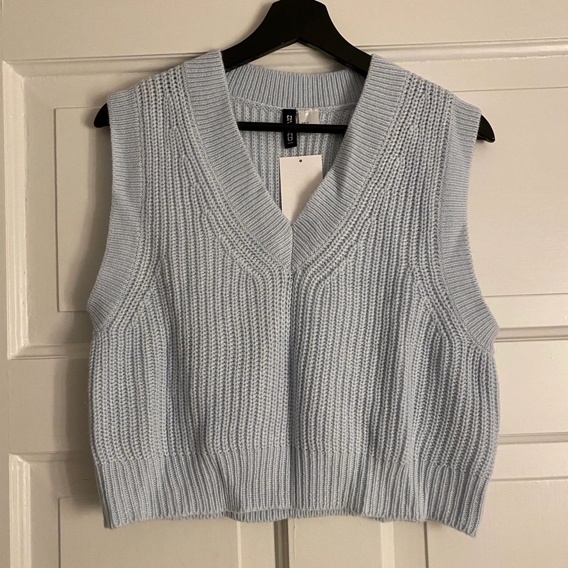 Ljusblå stickad väst