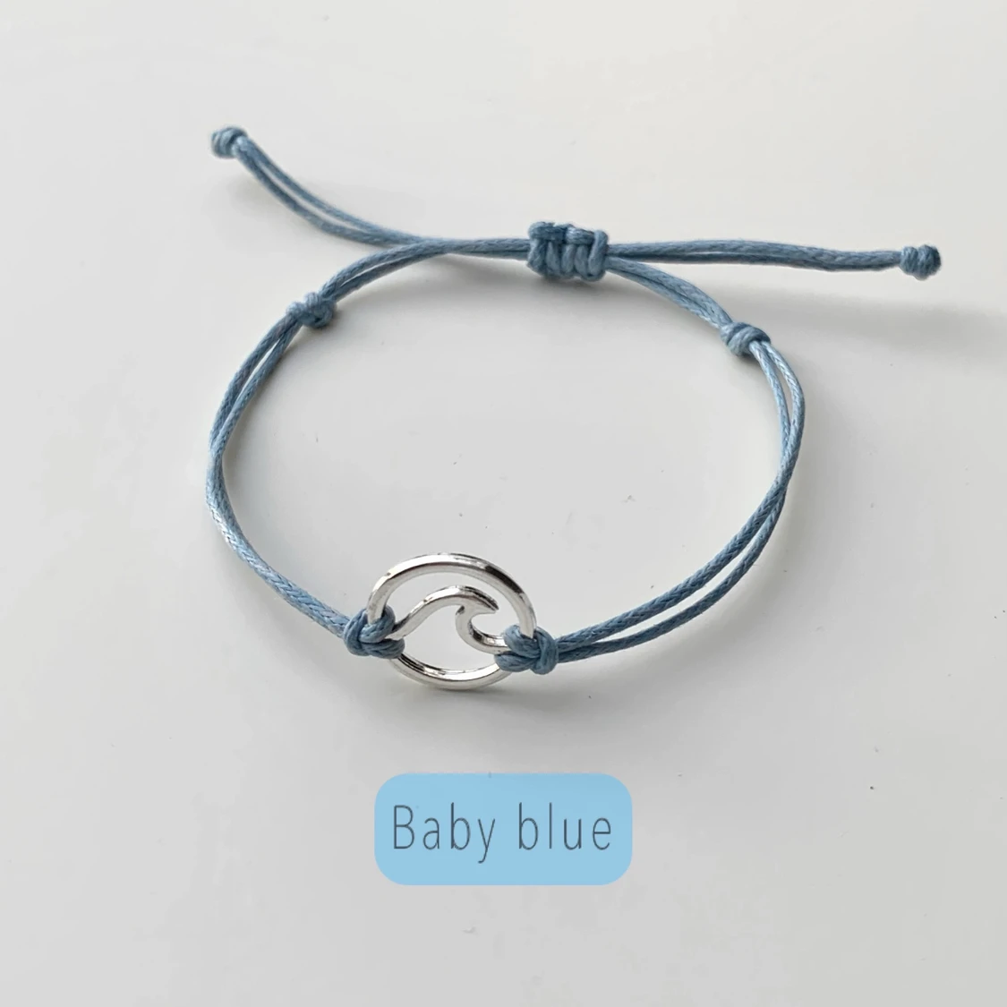 Armband i vaxad bomullstråd med en våg - 91