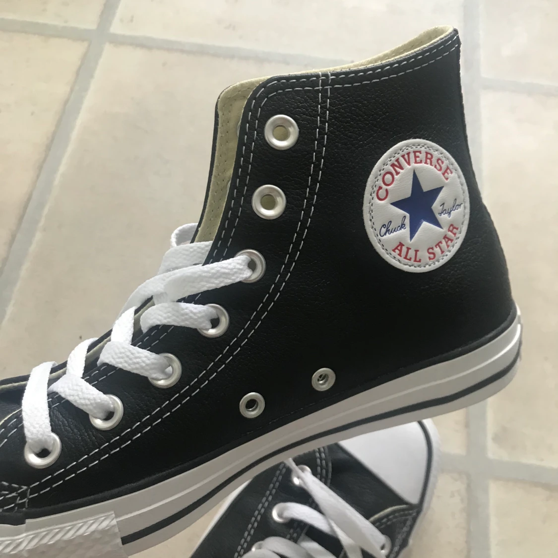 Svarta converse high tops