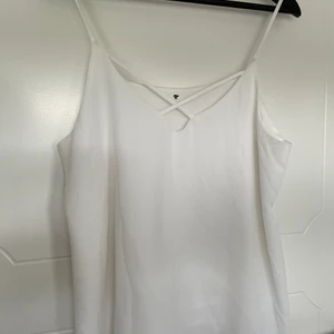 Shiffon tank top with cross cross detail - really cute tank top with a twist! 