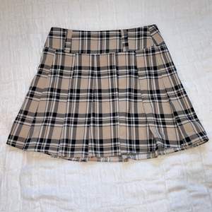 Pleated skater tennis skirt with burberry-inspired pattern // New condition // Buyer pays for shipping even though it says free shipping on this post