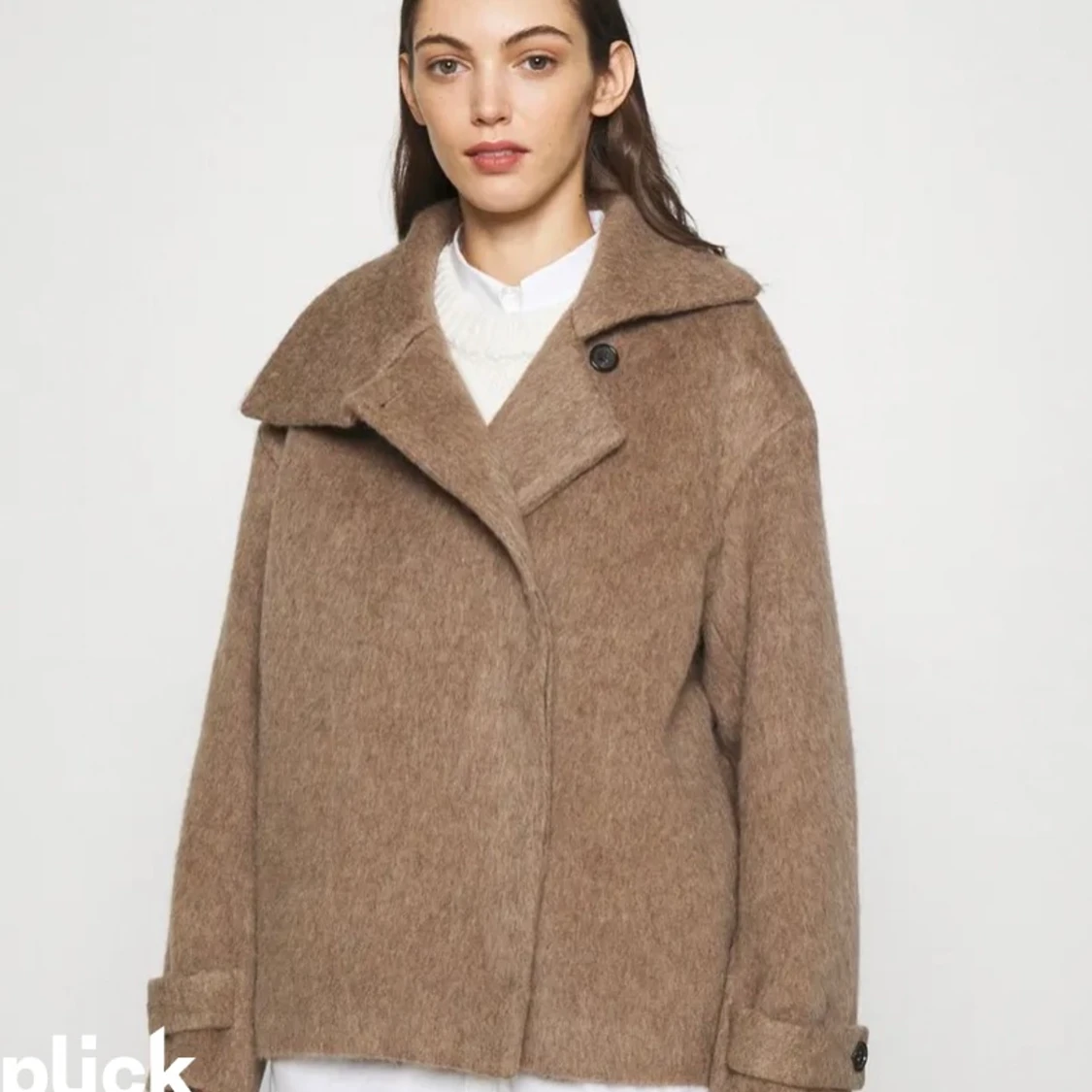 Söker kappa från arket