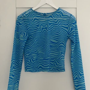 Meshtopp - Långärmad meshtopp med mönster