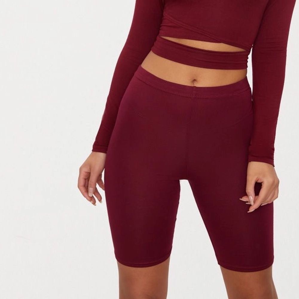 Bought from second hand. Tag size US 6 / EU 36. “bike shorts are an essential for the new season and we are loving this basic style. Featuring a maroon jersey material, team them with a maroon hue cropped sweater for a look we're loving.” No holes, tears, rips, stains, fading. Label and care instructions tags removed cuz they’re itchy. Smoke and pet free storage space. No other flaws to note. Disclaimer: Please expect some general wear in all secondhand pre-owned items as they have lived a previous life, so do not expect a mint item. . Shorts.