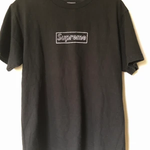 Supreme x Kaws Black Box Logo Tee - Supreme x Kaws Black Box Logo T-Shirt Size medium, fits like a regular men’s size small / medium.  Excellent condition, no flaws or damage.  DM if you need exact size measurements.   Buyer pays for all shipping costs. All items sent with tracking number.   No swaps, no trades, no offers. 