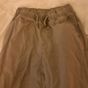 Beige loose pull-on - Worn a few times and in good condition, loose pull-on