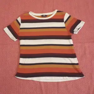 (size 38) shirt with horizontal white, orange, burgundy, sparkly gold and sparkly dark blue stripes