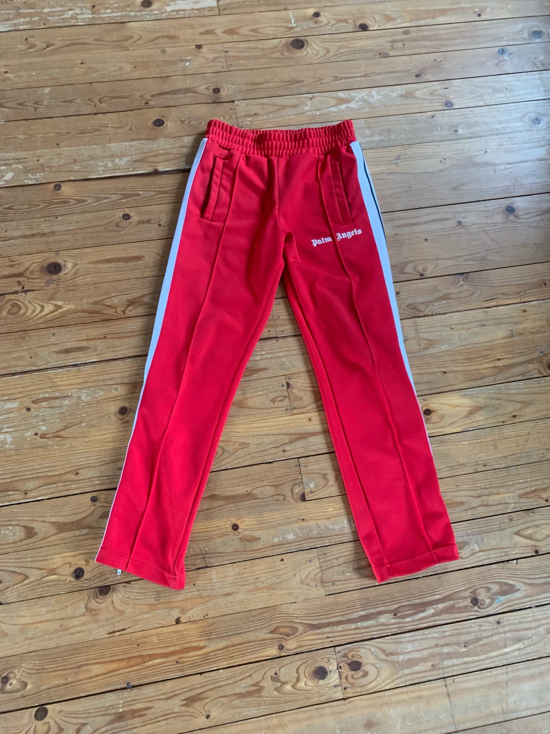 Röda palm angels byxor