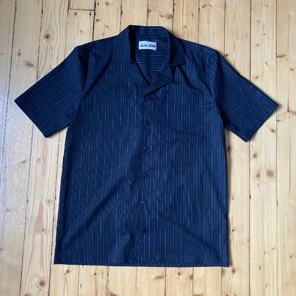 Nice and light camp collar shirt from Swedish label Séfr Séfr. Fabric feels very soft and flows really nicely. Probably fits a size S/46 as well. Still in very good condition. . Blusar.