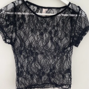 Spelstopp  - Svart spetstopp från NELLY, aldrig använd! 