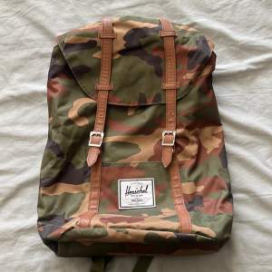 Herschel army backpack  Has a small mark on the top ser last photo. 