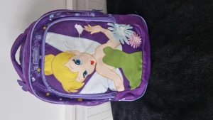 Ryggsäck - Lila ryggsäck för barn  Märket:samsonite.  (Jag står inte för frakten)