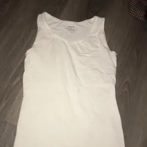 Cotton tank top in good condition save for a removable stain. 