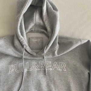 Gray Hoodie - Good condition. Relatively thick material. Size Small. Long on the torso. 