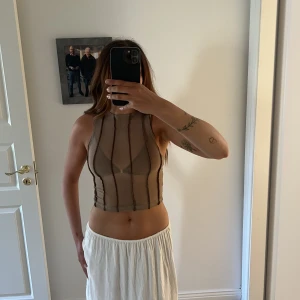 Topp - Genomskinlig topp från motelrocks, aldrig använd. Storlek xs