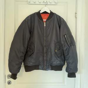 Mid 2000’s MA-1 bomber jacket. Bleach stains on the front. Size Small (fits bigger).