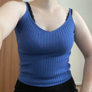 Blue knit top - Blue ribbed knit top with v-neck. Worn once. 