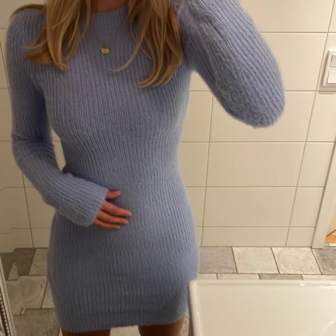 Långarmad klänning