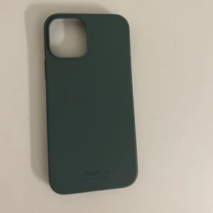 Mobilskal 12 - Ett mobilskal från holdit för iPhone 12. Detta är använt utan skador. Lite mer åt de turkos hållet. Används inte mer pga bytt mobil! Ett av mina favorit skal.