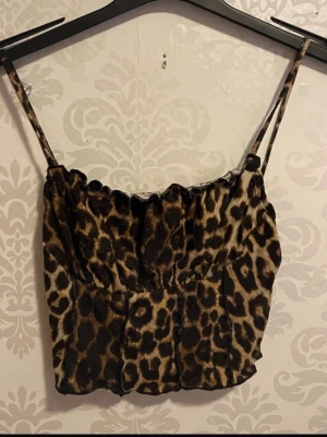 Leopardmönstrad linnetopp