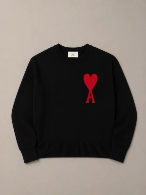 Ami Paris Ami de Coeur - Ami Paris svarta stickade tröja med ikoniskt rött hjärta och bokstaven A broderat på bröstet. Rund halsringning och långa ärmar ger en stilren look med en modern twist.
