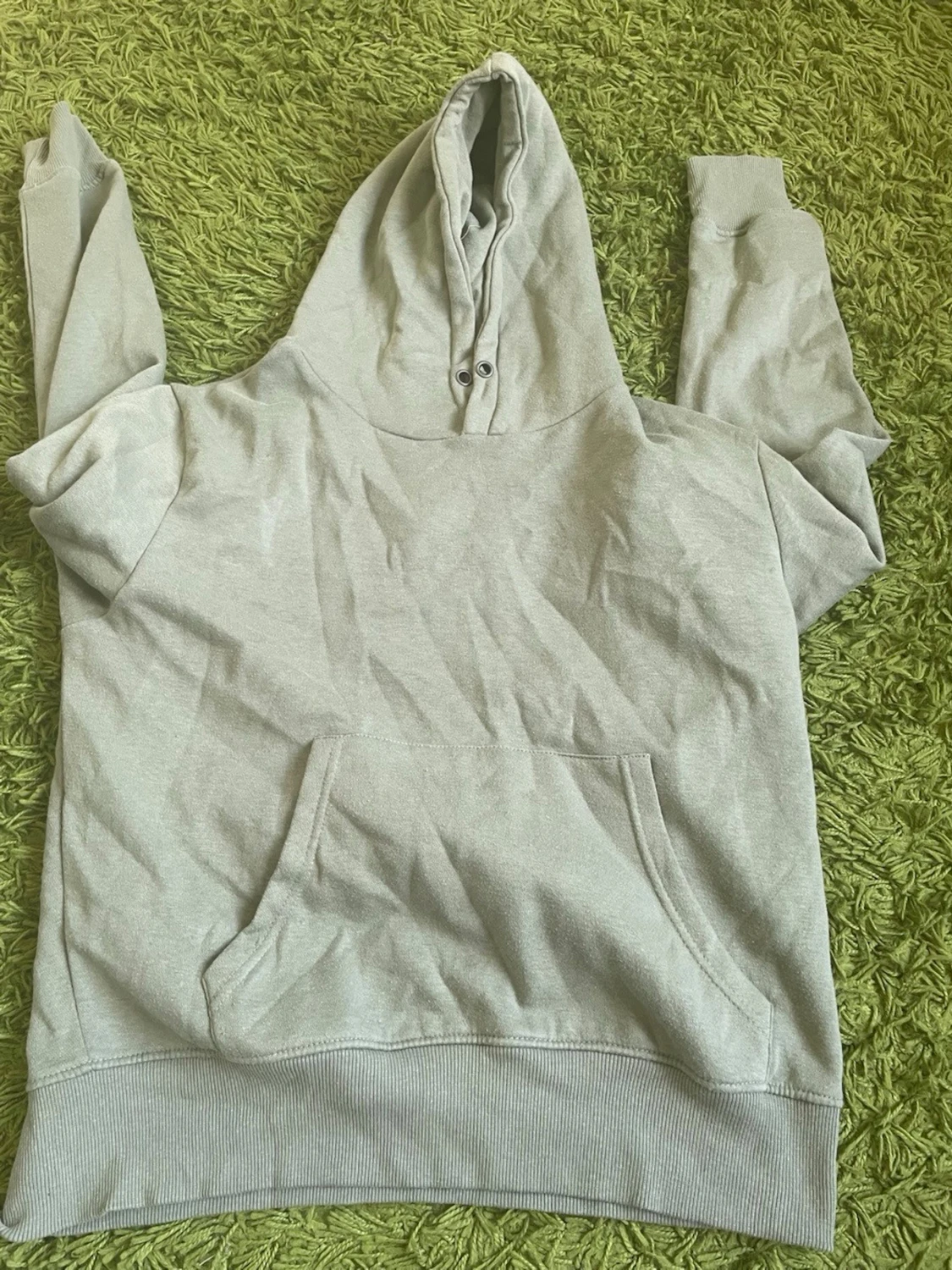 Ljusgrå hoodie med magficka