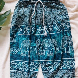 Royal Elephant men/women Harem Pants - Super comfortable light weight soft, draw string harem/Genie, casual, double stitched pants, fits all body types. Each pair is unique and may slightly vary from the picture.   Waist 24-44" - 57 cm to 108 cm  Hip 54 - 138 cm  Length 41" - 105 cm  100% Rayon