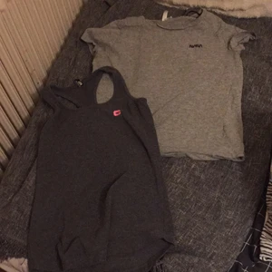 T-shirt och ett linne - Två tröjor båda för 50kr eller en för 25kr den gråa tröjan är i storlek s och i linnet är det storlek medium hämtas i Eslöv