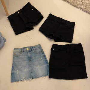 Kjolar och jeans från Lindex,hm,Åhlens - Två svarta shorts 140 och 146 , Hm                                              Blå jeans kjol 128, Lindex                                                              Svart jeans kjol 146/152 Åhléns 