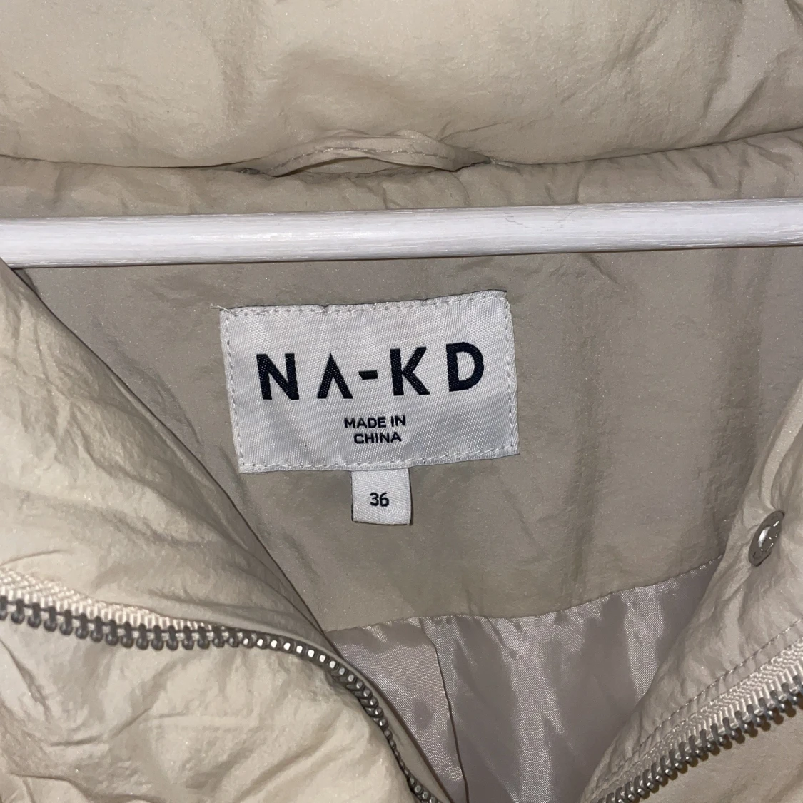 En beige jacka från NAKD.  - 91