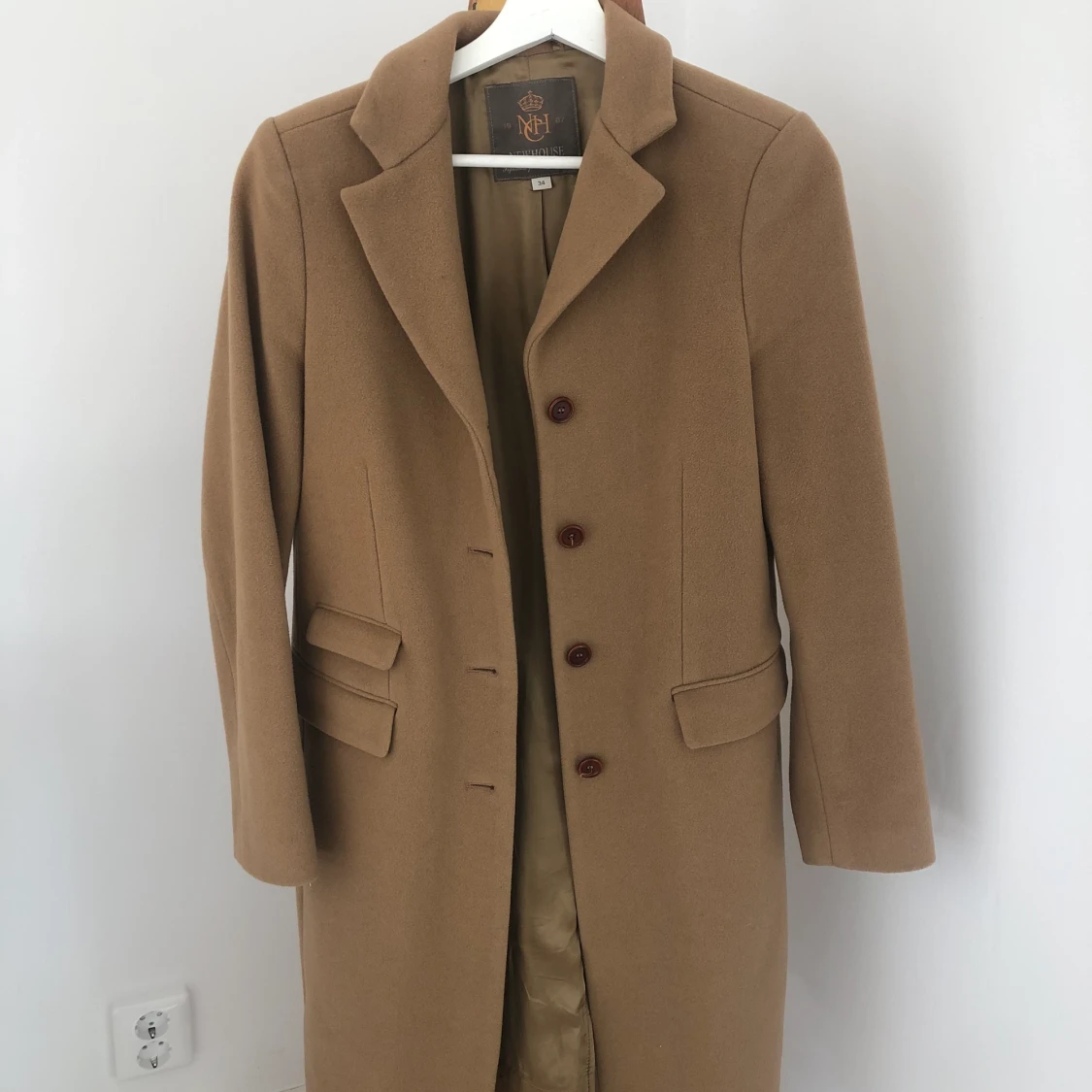 Brun kappa från NEWHOUSE storlek 34 - 90