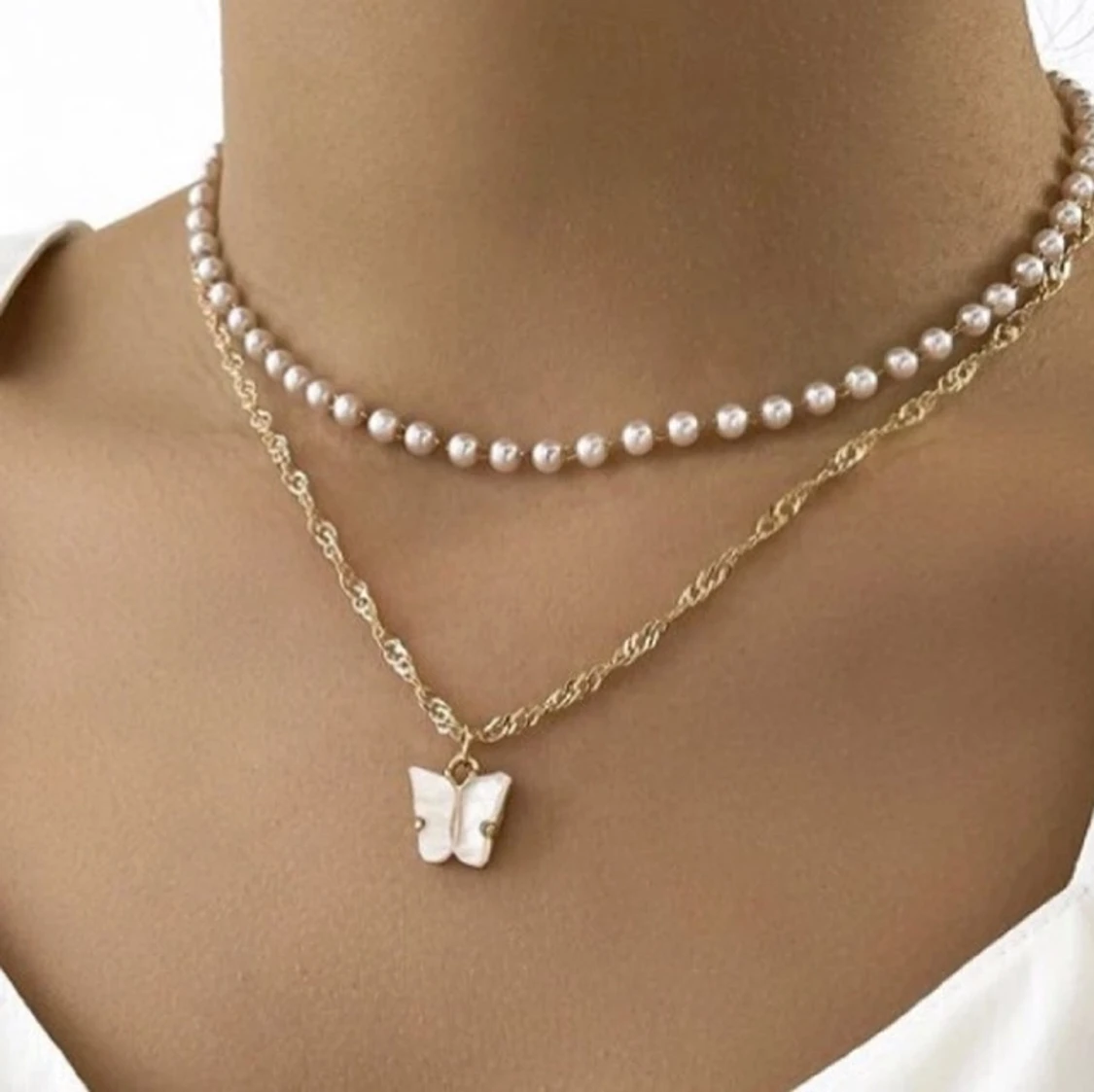 Fjärils halsband med pärlor