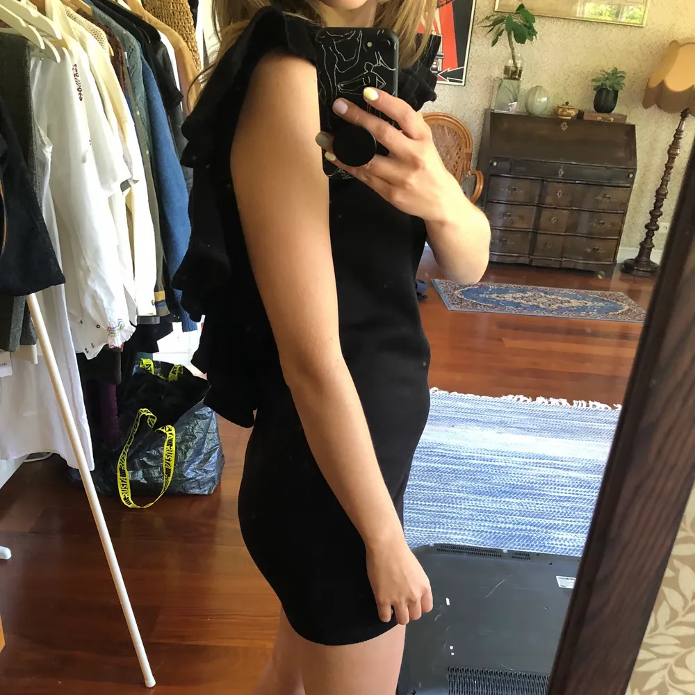Black mini dress in sweat fabric with cut out back. Very short and sexy dress but still casual because of the fabric. . Klänningar.