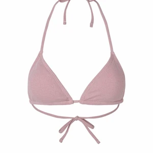 Bikini - Säljer en helt oanvänd bikini överdel från venderbys. Den ligger oöppnad i påsen som jag fick den i. Alltså i ett perfekt skick. Den är rosa med lite glitter i som kanske inte syns på bilden. Säljer den för att jag fick en för mycket av den. Frakt tillkommer.