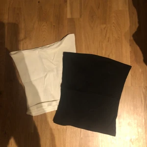Två toppar  - Två tub toppar från hm, en cream färgad och en svart, ribbat material. Storlek S men väldigt stretchigt material