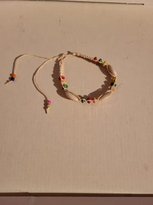 Vintage puka bracelet  - Adjustable, small signs of wear.  Bundle discounts: two items 5% off (automatic) three items 10% off, five items 20% off. Message me before purchasing 3+ items for discount.