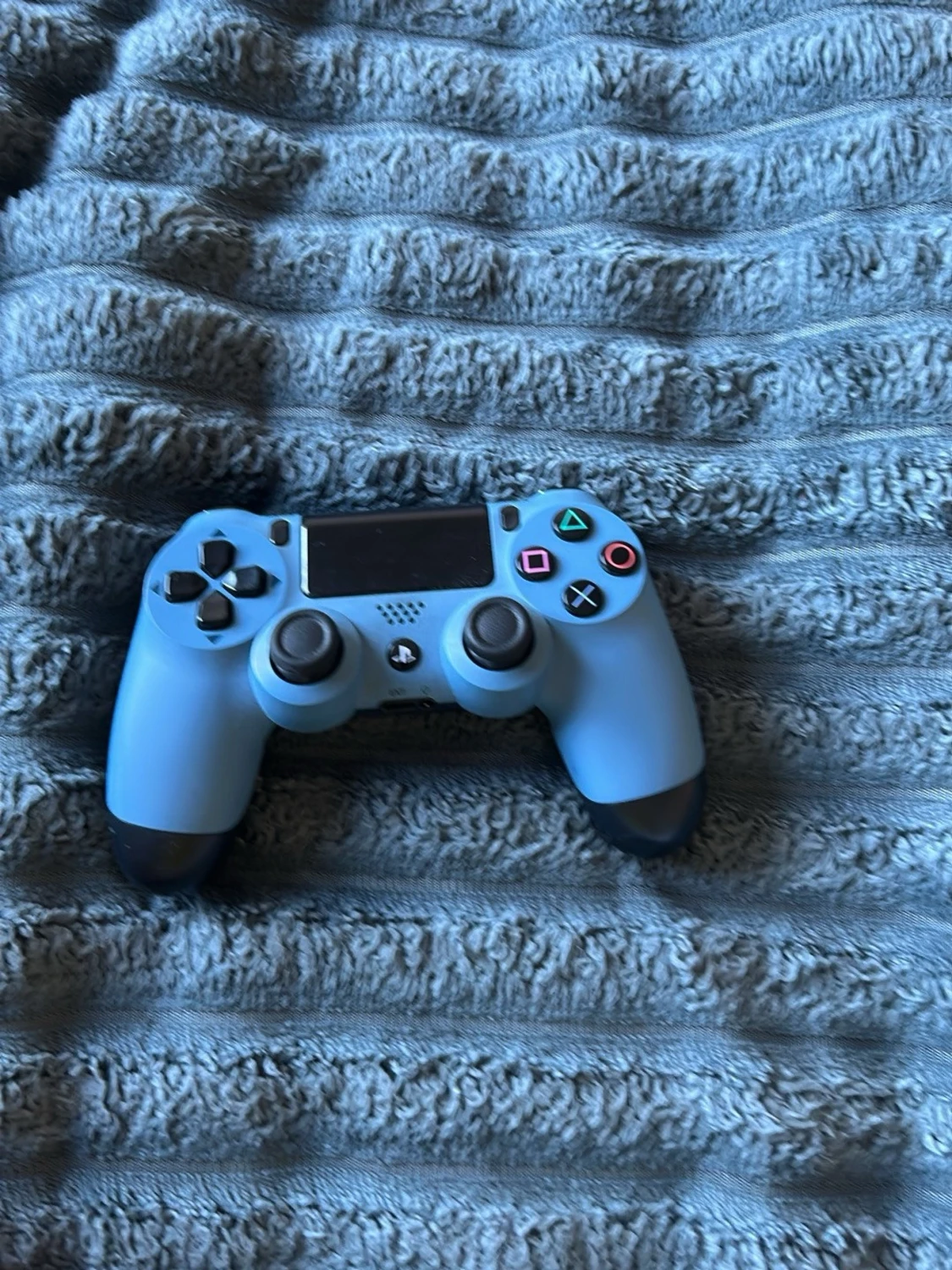 Blå PlayStation 4 DualShock handkontroll