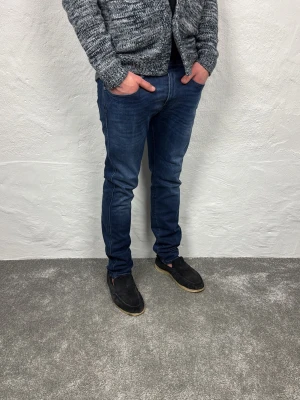 Replay jeans  - Ett par riktigt snygga jeans från Replay i storlek W33 L32 i modellen Anbbas hyperflex 