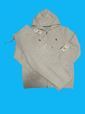 Ralph Lauren Tracksuit Size M (Light grey) - Brand: Ralph Lauren Condition: Brand new  Color: Light grey Size: Medium Measurements: Pants length 104cm waist 40-50 Zip hoodie length 68cm shoulder 48cm  • Message for questions or offers  • Cheaper if you buy more items • Delivery within 24hrs