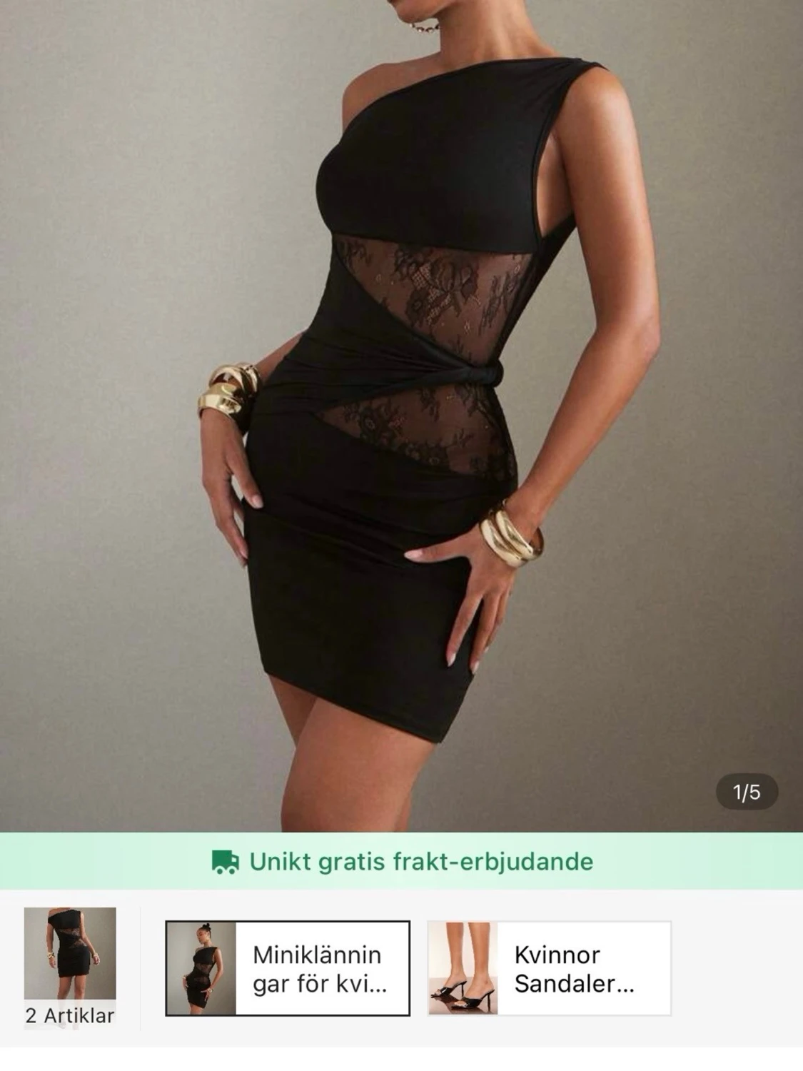 Svart omlottklänning med spetsdetaljer - 1