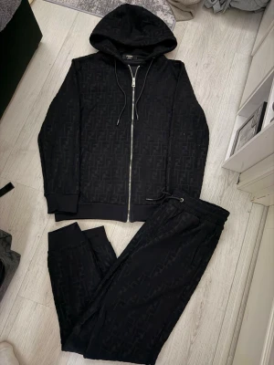 Fendi black tracksuit - Size M, true to size. Very comfortable and perfect fit.