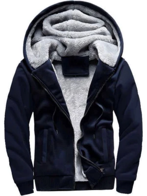 Mörkblå hoodie med fluffigt foder - Mysig mörkblå hoodie med dragkedja och stor huva. Insidan är fodrad med mjukt, ljust grått teddyfoder som gör den extra varm. Två fickor framtill och ribbade muddar vid ärmar och nederkant. Perfekt för kalla dagar och riktigt skön att ha på sig.